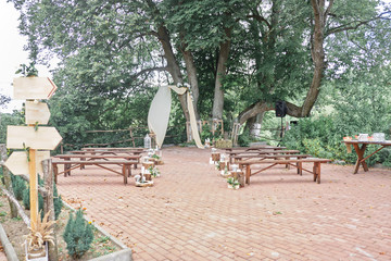 Outdoor wedding venue. Wedding arch. Flower decorations