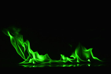 Beautiful fire green flames on a black background.