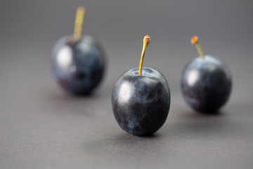 Whole plums in a macro studio shot