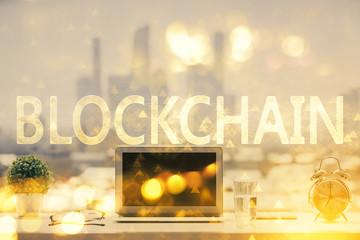 Double exposure of blockchain and crypto economy theme hologram and table with computer background....