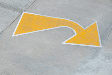 Yellow arrow traffic sign indicates minor road to turn left to major road