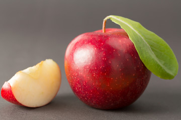Apple closeup with a slice at the side in a studio shot with macro lens.
