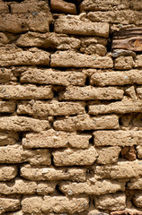 Background of old wall made of adobe or mudbrick masonry