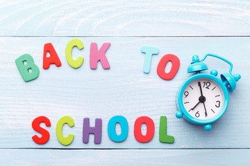 Colorful wooden letters on blue background