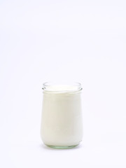 Fresh blueberry yogurt glass on a white background