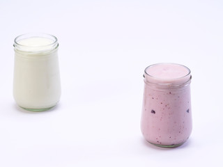 Fresh blueberry yogurt glass on a white background