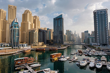 Fototapeta na wymiar Dubai marina with boats and buildings, United Arab Emirates