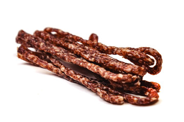 Small smoked sausage with spice isolated on white background