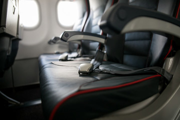 Airplane cabin seats with passengers. Economy class of new cheapest low-cost airlines without delay or cancellation of flight.