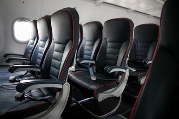 Airplane cabin seats with passengers. Economy class of new cheapest low-cost airlines without delay or cancellation of flight.