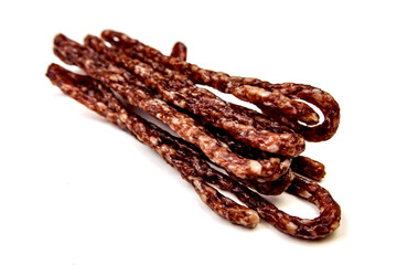 Small smoked sausage with spice isolated on white background