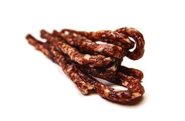 Small smoked sausage with spice isolated on white background