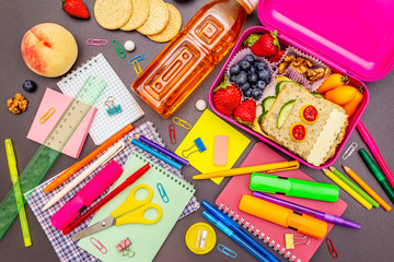 School lunch box with school supplies