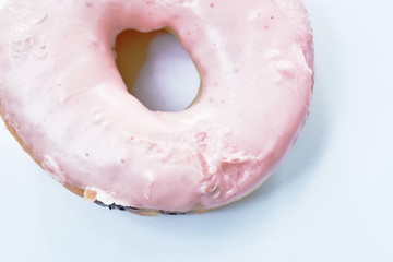 strawberry cream donuts on white background