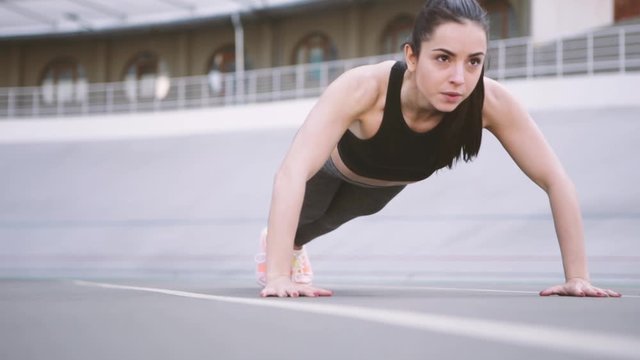 Woman making sport exercises, woman power, work hard. 