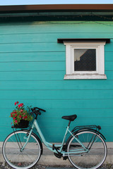 bicycle in front of wooden wall