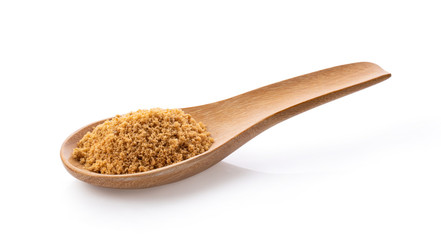 Brown sugar in wood spoon isolated on white background