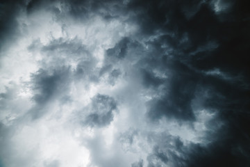 Dramatic cloudscape texture. Dark heavy thunderstorm clouds before rain. Overcast rainy bad weather. Storm warning. Natural gray background of cumulonimbus. Nature backdrop of stormy cloudy sky.