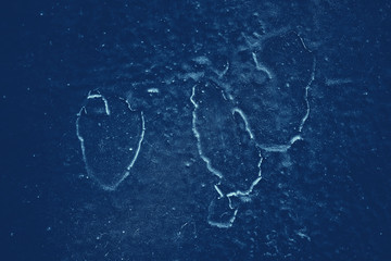 Vintage blue background. Rough painted wall of sapphire color. Imperfect plane of blue colored. Uneven old decorative toned backdrop of cyan tint. Texture of sapphirine hue. Ornamental stony surface.