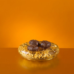 Chocolates in gold leaf dish