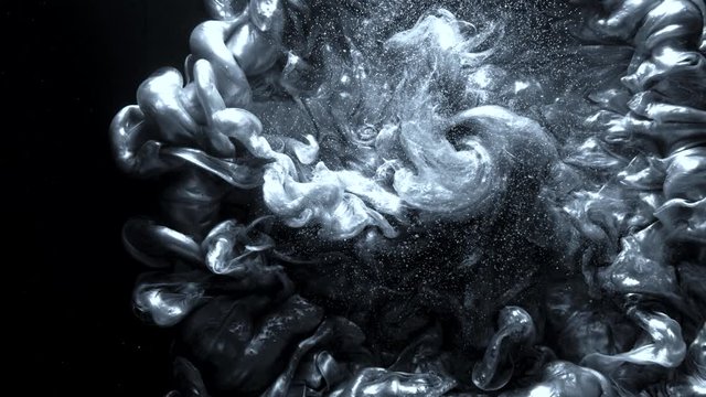 Ink explosion. Chemical fluid leak. Silver glitter motion.