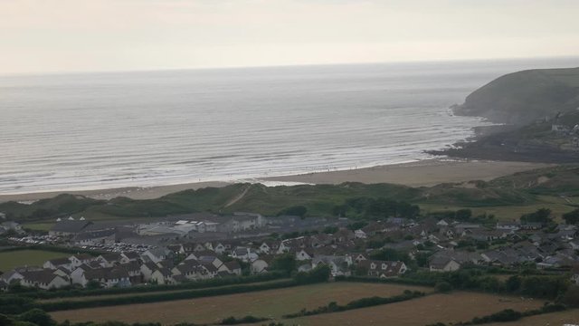 Beautiful View of the coastal town with a view of the houses, the beach and the sea in Croyde England.