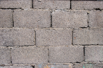 Grey brick wall surface texture background pattern worn weathered