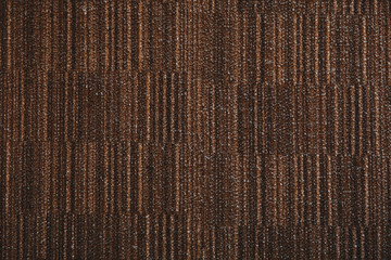 Brown tiled carpet texture pattern background. Carpet floor texture in office or home decor. 
