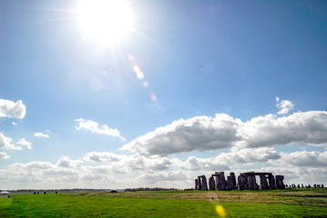 Stonehenge Monoliths with vast field around, blue sky with clouds, England, UK