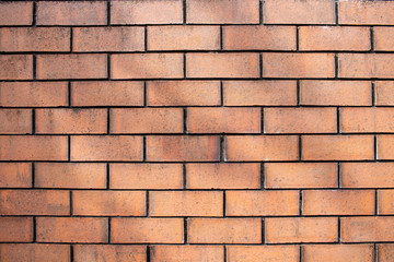 Worn orange brick wall surface texture background