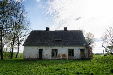 Fototapeta na wymiar Abandoned farmstead in rural area