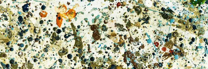 Abstract background with multi-colored spray, spots, blots from oil paint. palette of color paints. banner with copy space.