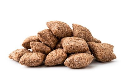 Pile of corn flakes pads close-up on a white. Isolated