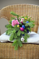 Bouquet of Christmas tree with Christmas decorations and live carnations and roses.