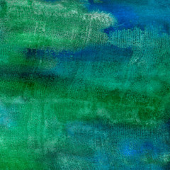 Watercolor background with green and blue streaks. Hand-drawn texture