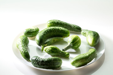 Ugly freak organic cucumber on a white background. The concept of organic vegetables. Space for text