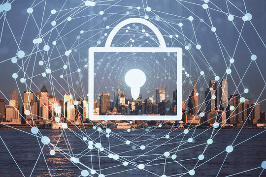 Lock icon hologram on city view with skyscrapers background multi exposure. Data security concept.