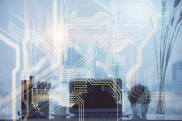 Double exposure of desktop with computer and world map hologram. International data network concept.