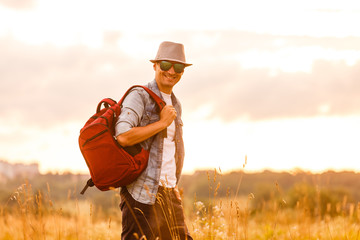 Portrait of handsome Male Hiker and Backpack
