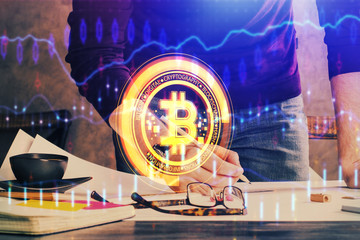 Man's hands working with notes background. Cryptocurrency and finance concept.