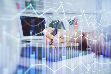 Financial graph displayed on woman's hand taking notes background. Concept of research. Double exposure
