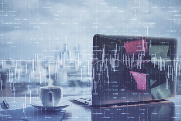 Financial chart drawing and table with computer on background. Double exposure. Concept of international markets.