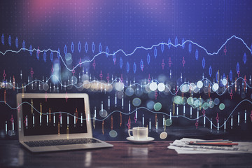 Financial graph colorful drawing and table with computer on background. Double exposure. Concept of international markets.