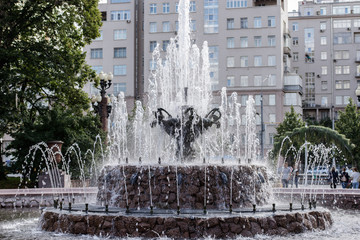 The fountain in the form of a bowl adorns the city square, which is an element of the urban landscape.