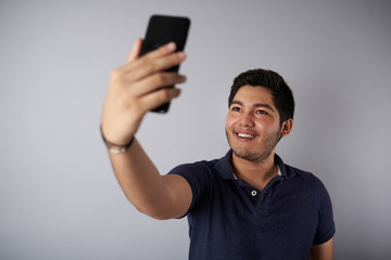 Teenager taking selfie