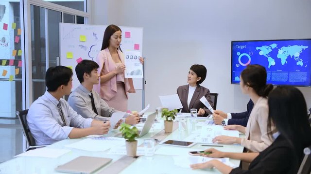 Business concept. Businesswomen are presenting the meeting report.