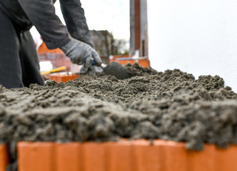 Naklejka premium construction brick concrete building worker