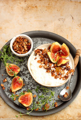 Healthy breakfast with cottage cheese, granola and figs 