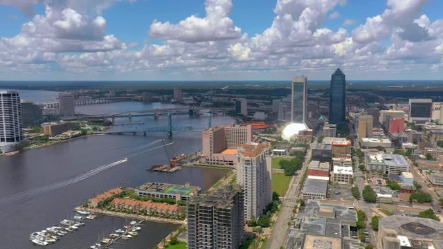 Aerial panning footage of Downtown Jacksonville and St Johns River