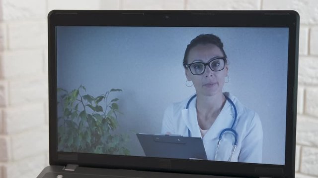 The doctor advises on the Internet. Bad Internet. Doctor video call. Doctor doctor in a laptop monitor.